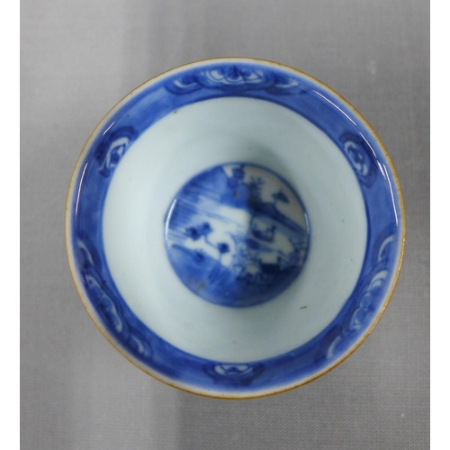 84 - Chinese cafe au lait blue and white glazed tea bowl and saucer (chip to saucer) and a famille rose t... 