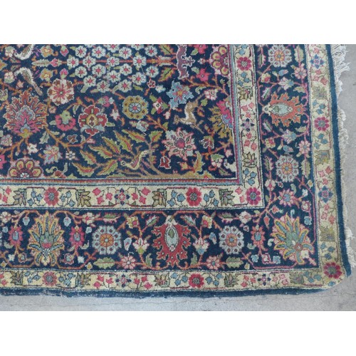 343 - Persian rug, blue field with flowering trees and flowerhead border, 290 x 191