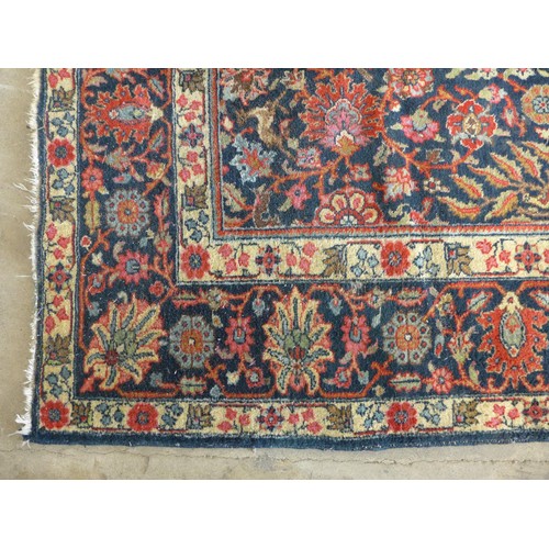 343 - Persian rug, blue field with flowering trees and flowerhead border, 290 x 191