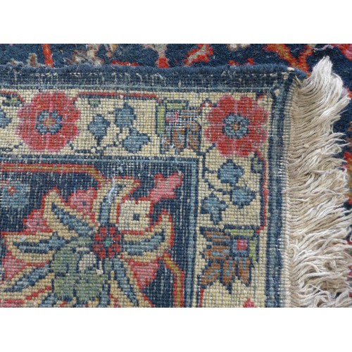 343 - Persian rug, blue field with flowering trees and flowerhead border, 290 x 191