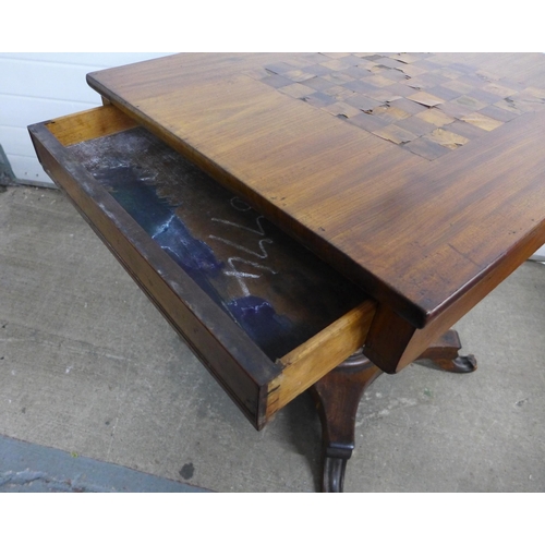 344 - Mahogany games table, rectangular top and two drawers, on a tapering column and quadripartite platfo... 