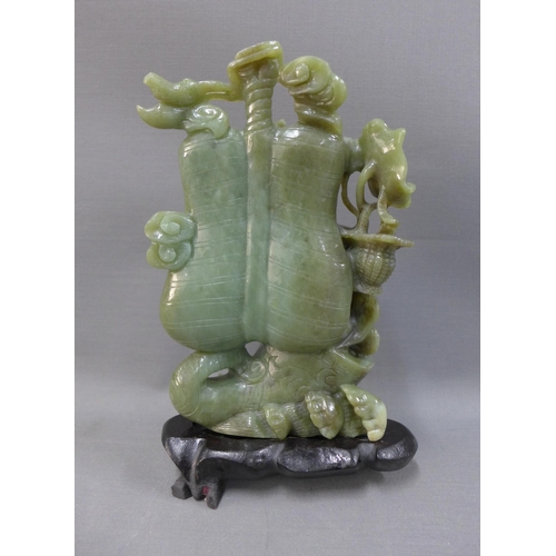 104 - Jade carved sculpture on hardwood stand, 19cm