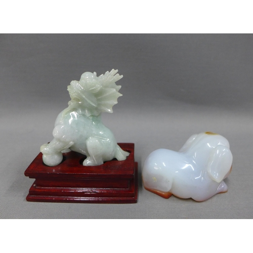 105 - Jade temple lion dog and a carved jade dog, 7cm  (2)