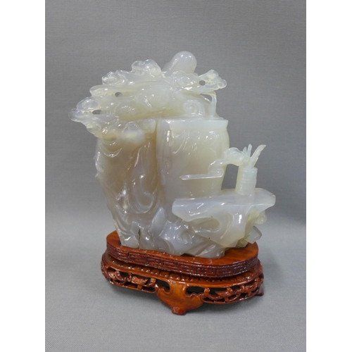 107 - Jadeite carving of an Immortal figure, on wooden stand, 12cm