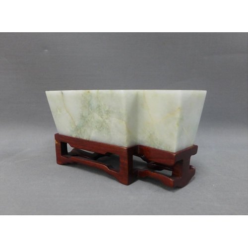 108 - Jade brush washer of geometric form, on a wooden stand, 13cm