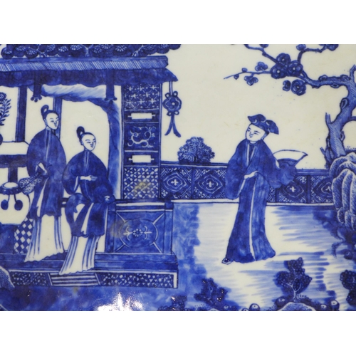 134 - Chinese Qianlong blue and white serving plate of rectangular canted form, painted with figures withi... 