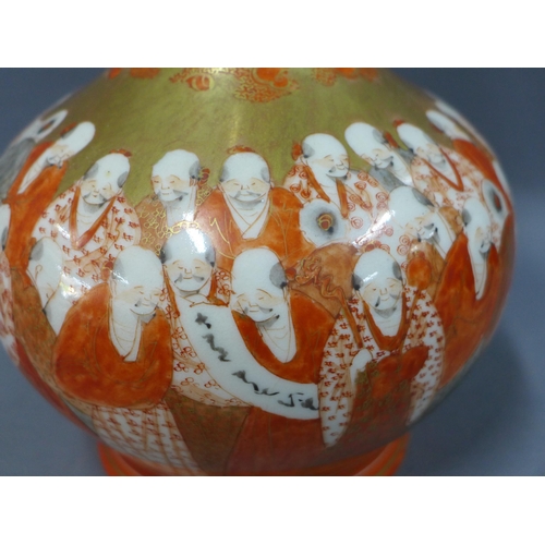 136 - Japanese Kutani porcelain vase, Meiji period, painted with two bands of figures, 31cm