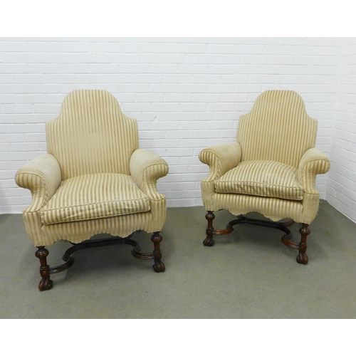 202 - A pair of Carolean style walnut cream upholstered armchairs with serpentine padded backs, scroll arm... 