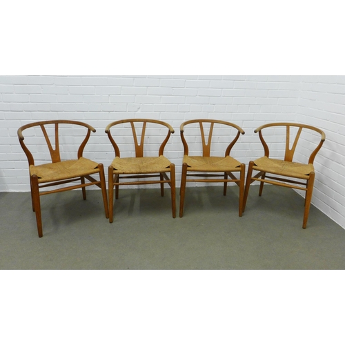 212 - Hans Wegner (Danish, 1914-2007) for Carl Hansen, a set of four Wishbone Chairs, stamped Carl Hansen ... 