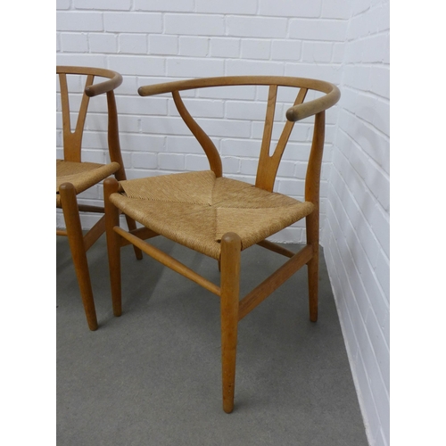 212 - Hans Wegner (Danish, 1914-2007) for Carl Hansen, a set of four Wishbone Chairs, stamped Carl Hansen ... 