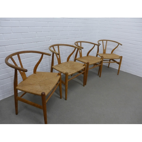 212 - Hans Wegner (Danish, 1914-2007) for Carl Hansen, a set of four Wishbone Chairs, stamped Carl Hansen ... 