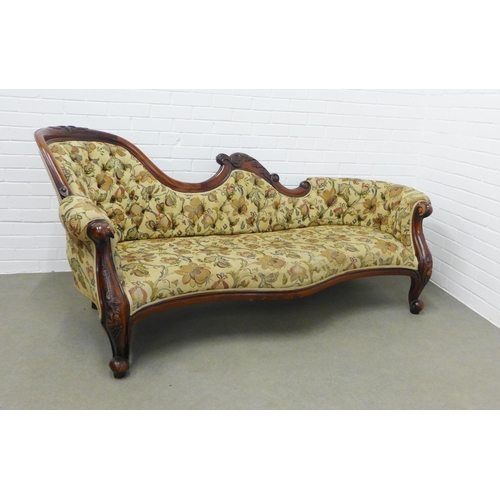 214 - Mahogany framed three seater settee, carved top rail and button back padded back, upholstered in flo... 