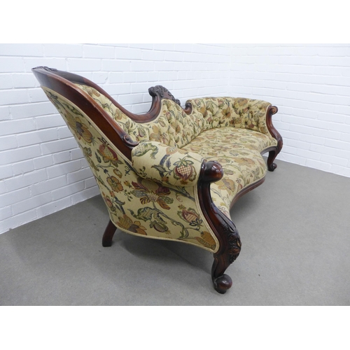 214 - Mahogany framed three seater settee, carved top rail and button back padded back, upholstered in flo... 