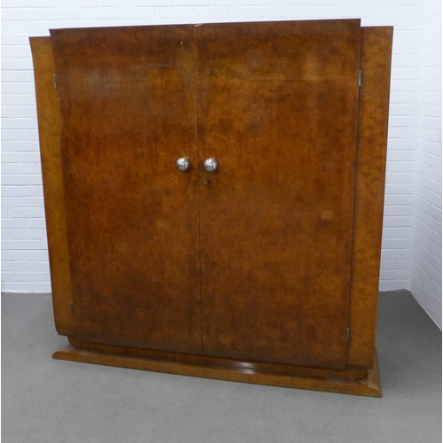 221 - French Art Deco walnut armoire by Roger Bal, Paris, with stylised curve doors and silvered handles, ... 