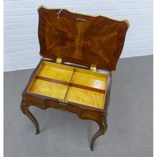 230 - French Louis XV style kingwood inlaid  and brass mounted table, with lift up top and an interior wit... 