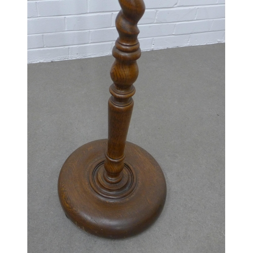 234 - Oak barley twist standard lamp. Height is 161cm.