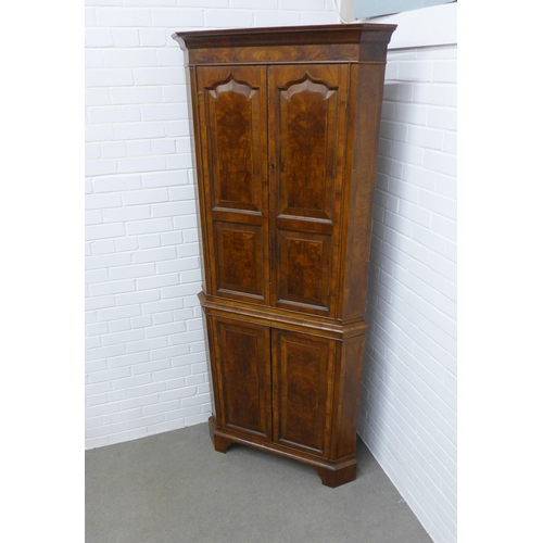 240 - Walnut floor standing corner cupboard, the interior with blue painted shelves, 112 x 60 x 49cm