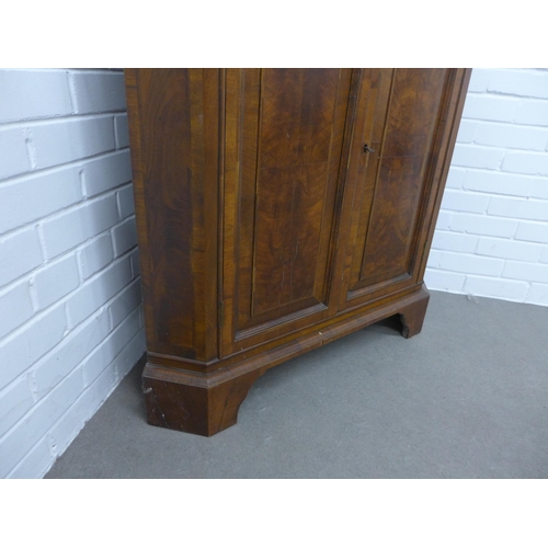 240 - Walnut floor standing corner cupboard, the interior with blue painted shelves, 112 x 60 x 49cm