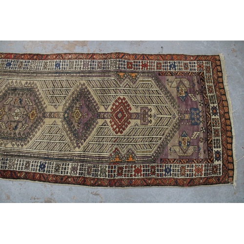 267 - Persian runner, ivory field with a pole medallion and multiple geometric borders,  warped, 310 x 85c... 