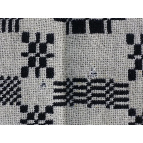 273 - Welsh wool blanket, black and white reversible, 170 x 240cm together with another floral quilt (2)