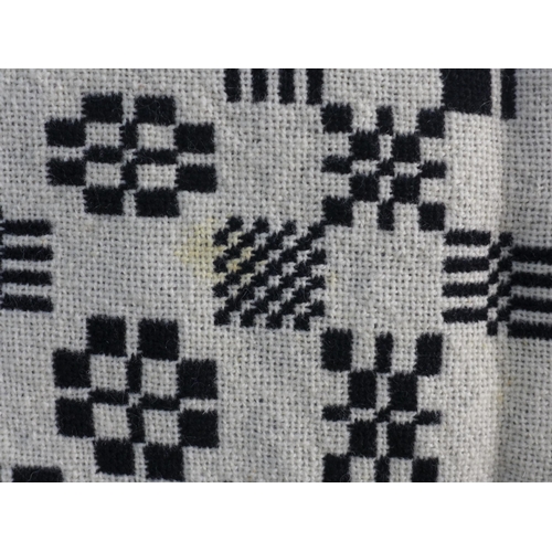 273 - Welsh wool blanket, black and white reversible, 170 x 240cm together with another floral quilt (2)