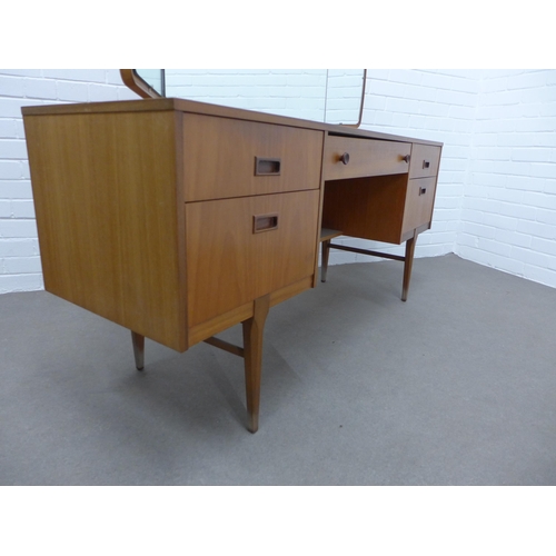 281 - Teak dressing table and stool. Stamped Nathan to the drawer. 110 x 153 x 45cm