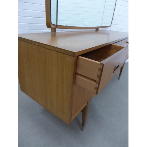 281 - Teak dressing table and stool. Stamped Nathan to the drawer. 110 x 153 x 45cm