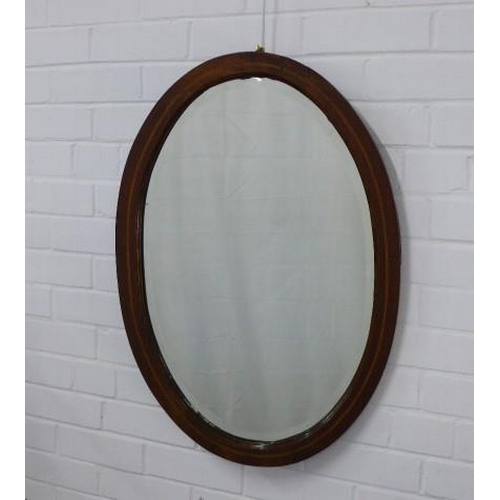 285 - Mahogany oval wall mirror with chequer banding, 52 x 74cm