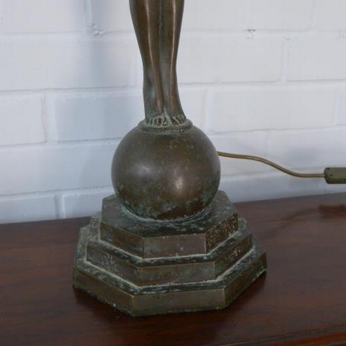 294 - Art deco style figural bronze table lamp, with a Tiffany style shade 98cm tall