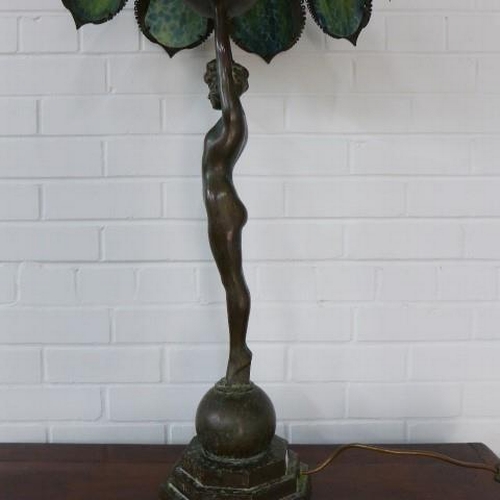 294 - Art deco style figural bronze table lamp, with a Tiffany style shade 98cm tall