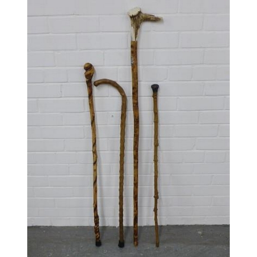 296 - Four walking sticks, longest 124cm (4)