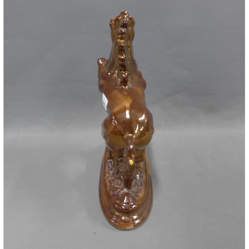 306 - Brown lustre glazed rearing horse figure