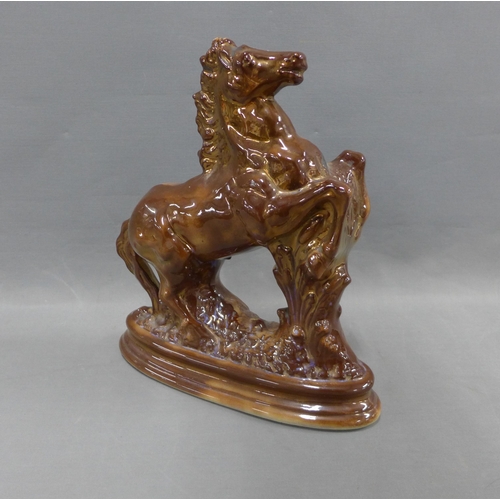 306 - Brown lustre glazed rearing horse figure