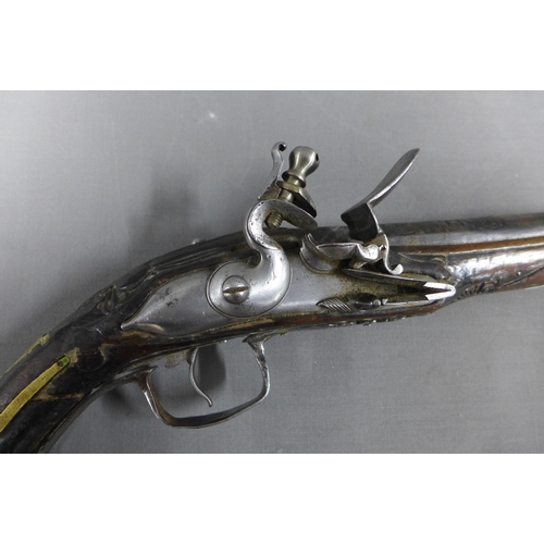 317 - Two Eastern flintlock percussion pistols, a near pair, 48.5cm overall, (a/f with losses) (2)