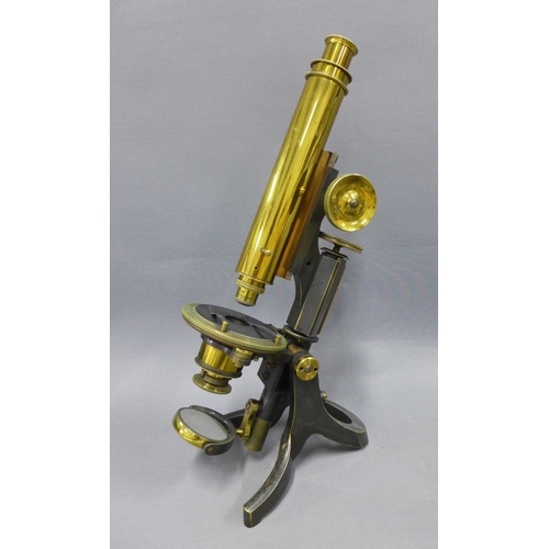 340 - Swift & Sons petrological microscope, in black and brass, 36cm tall