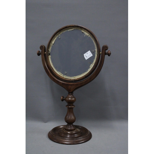 341 - Mahogany framed swmirror, circular plate on a turned column with circular base, 59cm