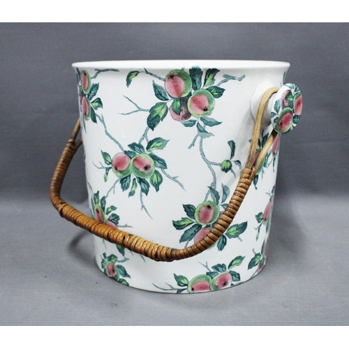 343 - Staffordshire pail with transfer printed apples pattern, raffia swing handle, 25cm