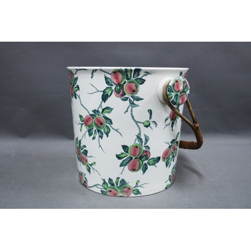 343 - Staffordshire pail with transfer printed apples pattern, raffia swing handle, 25cm