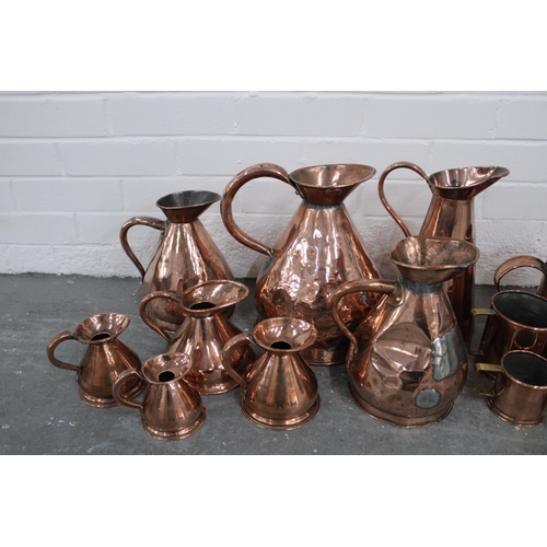 363 - Collection of 19th century and later copper wares to include harvest jugs, gill measures, cider meas... 