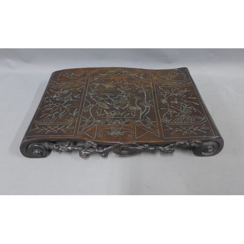 370 - Silver inlaid hardwood stand of scroll form, the top with lotus and cranes, 46 x 30cm