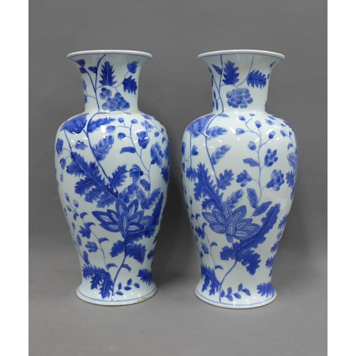 389 - Pair of modern Chinese blue and white baluster vases, 35cm (2)