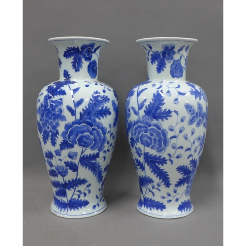 389 - Pair of modern Chinese blue and white baluster vases, 35cm (2)