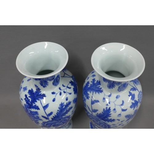 389 - Pair of modern Chinese blue and white baluster vases, 35cm (2)