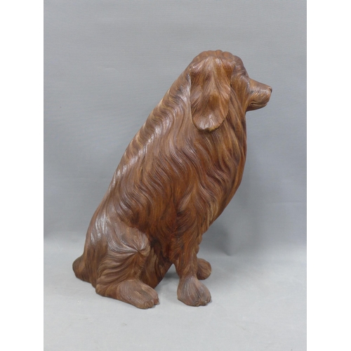 395 - Carved wood model of a seated dog, 43cm