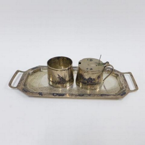 82a - Collection of Eastern white metal and niello  to include cruet stand, cruet trays and cruets, napkin... 