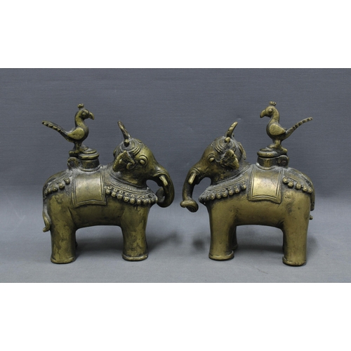 107 - A pair of Indian bronze elephant Temple oil lamp / incense burners, the hinged covers in the form of... 