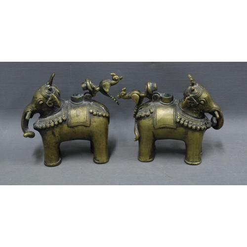 107 - A pair of Indian bronze elephant Temple oil lamp / incense burners, the hinged covers in the form of... 