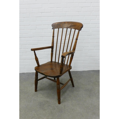 308 - An elm Windsor chair. 105 x 59 x 45cm.