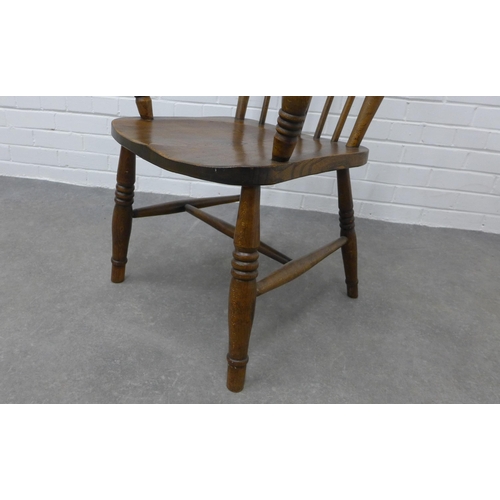 308 - An elm Windsor chair. 105 x 59 x 45cm.