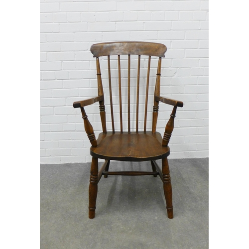 308 - An elm Windsor chair. 105 x 59 x 45cm.